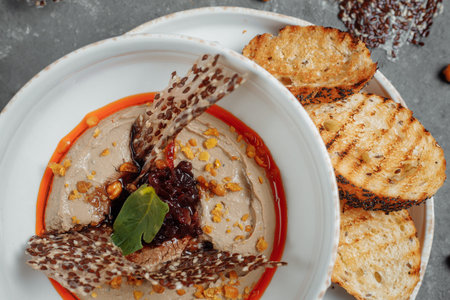 Mushroom cream soup on dark background. Champignon soup