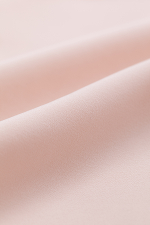 Close-up of light pink clothの写真素材