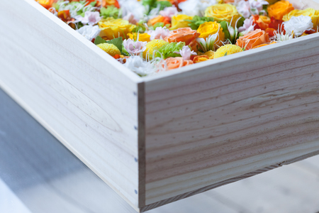 Colorful preserved flower in a wooden boxの写真素材