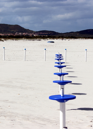 some poles on the beachの写真素材