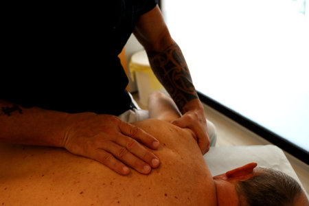 Man having a back massage in a spa salon. Body care concept.の写真素材