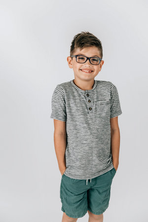 Little caucasian boy shorts on an with glasses or eyeglasses