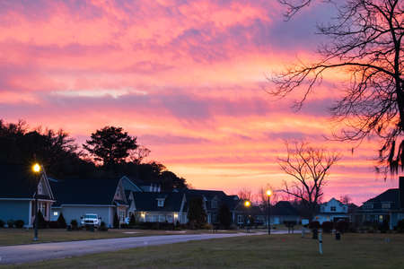 New construction beighborhood at sunset with a purple orange sky.の写真素材