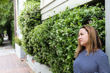 a single woman in her 40s outside in Savannah, Georgia in the springの写真素材