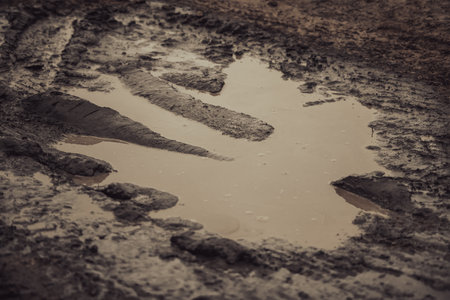 A dark and moody mud puddleの写真素材