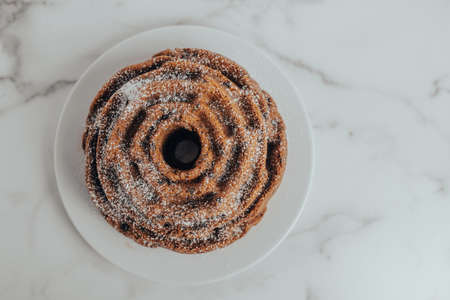 An ornate and decorative homemade and fresh chocolate chip bundt cakeの写真素材
