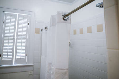 white bathroom shower with vintage tile in old cottageの写真素材