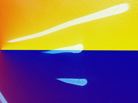 Closeup of colorful urban texture in Ukraine flag color - yellow and blue. Ukraine flag cairless...