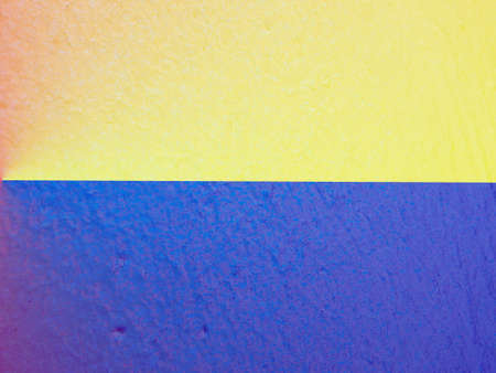 Closeup of colorful urban texture in Ukraine flag color - yellow and blue. Ukraine flag cairless paint shading with image of national flag. independence day banner.の写真素材