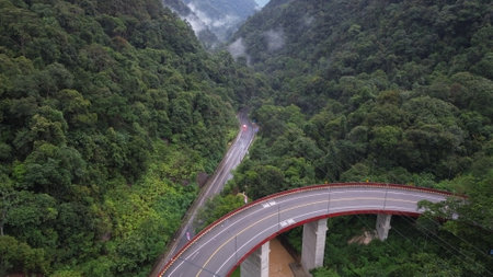Aerial view of the highway in the rainforest, Thailand.の写真素材