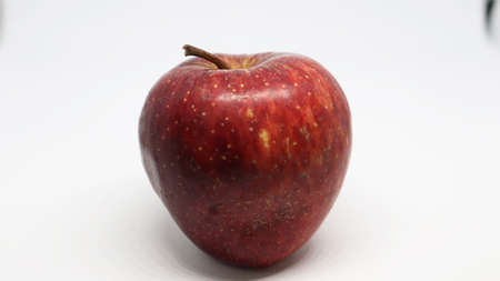 The red apple is on a white backgroundの写真素材