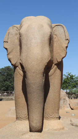 Stone sculpture of an elephant carved in a single rock. In the middle of rock and nature.