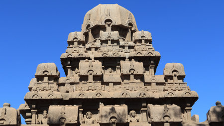 This is "five rathas" as they resemble the processional chariots of a temple. Statues carved in rock. this is one features in several Hindu scriptures. blue sky backgroundsの写真素材