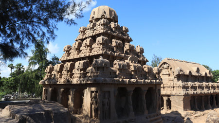 This is "five rathas" as they resemble the processional chariots of a temple. Statues carved in rock. this is one features in several Hindu scriptures. blue sky backgroundsの写真素材