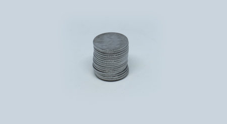 Indian Rupee Coins. Two rupee coins stacked in stacks. On a white background