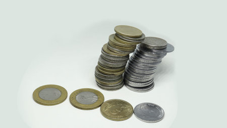 Indian Rupee Coins. five rupees coins. and two rupees silver coin stacked vertically. and down side...