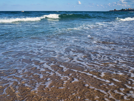 Surf and waves on the sandy shore of the Black Sea on a sunny summer day, Bulgaria, Primorsko, BGの写真素材