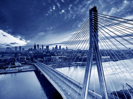 Beautiful panoramic aerial drone sunset view to Warsaw city center with skyscrapers and Swietokrzyski Bridge (En: Holy Cross Bridge) - is a cable-stayed bridge over the Vistula river in Warsaw, Polandの写真素材