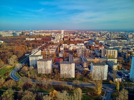 A beautiful panoramic view of the sunset in a fabulous November autumn evening at sunset from drone at Pola Mokotowskie in Warsaw, Poland - Mokotow Field is a large park called "Jozef Pilsudski Park"の写真素材