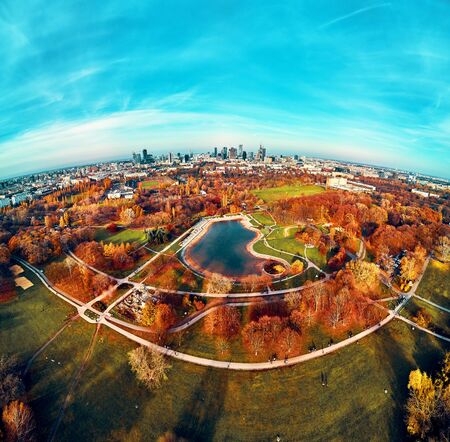 A beautiful panoramic view of the sunset in a fabulous November autumn evening at sunset from drone at Pola Mokotowskie in Warsaw, Poland - Mokotow Field is a large park calledの写真素材