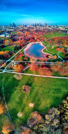 A beautiful panoramic view of the sunset in a fabulous November autumn evening at sunset from drone at Pola Mokotowskie in Warsaw, Poland - Mokotow Field is a large park calledの写真素材