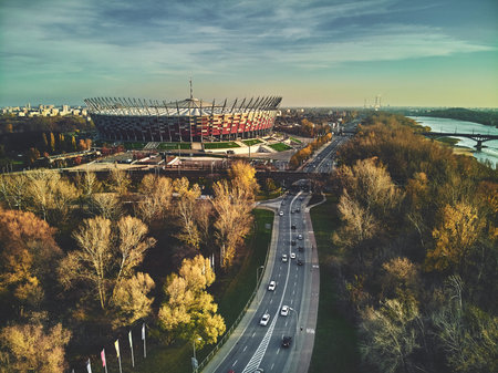 WARSAW, POLAND - NOVEMBER 17, 2019: Beautiful sunset panoramic aerial drone view to panorama of Warsaw modern City with skyscraper and The PGE Narodowy National Stadium (Polish: Stadion Narodowy)のeditorial素材