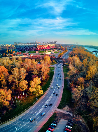WARSAW, POLAND - NOVEMBER 17, 2019: Beautiful sunset panoramic aerial drone view to panorama of Warsaw modern City with skyscraper and The PGE Narodowy National Stadium (Polish: Stadion Narodowy)のeditorial素材