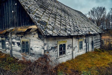 A terrible mysterious apocalyptic view: an abandoned house in the abandoned Belarusian Kovali (Belarusian: blacksmiths) village - no one lives here anymoreの写真素材