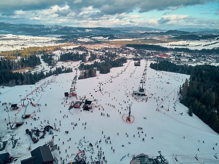 Beautiful panoramic aerial drone view to the ski slopes with lifts in the Bialka Tatrzanska ski resort Tatra Mountains (Tatras, Tatra) - mountain range between Slovakia and Poland, PLの写真素材