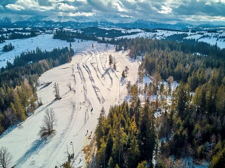 Beautiful panoramic aerial drone view to the ski slopes with lifts in the Bialka Tatrzanska ski resort Tatra Mountains (Tatras, Tatra) - mountain range between Slovakia and Poland, PLの写真素材