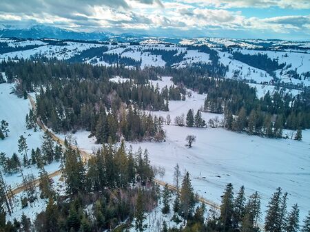 Beautiful panoramic aerial drone view to the ski slopes with lifts in the Bialka Tatrzanska ski resort Tatra Mountains (Tatras, Tatra) - mountain range between Slovakia and Poland, PLの写真素材