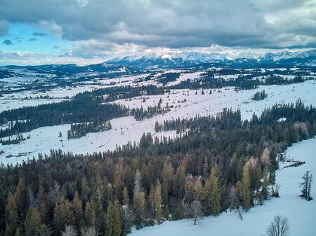 Beautiful panoramic aerial drone view to the ski slopes with lifts in the Bialka Tatrzanska ski resort Tatra Mountains (Tatras, Tatra) - mountain range between Slovakia and Poland, PLの写真素材