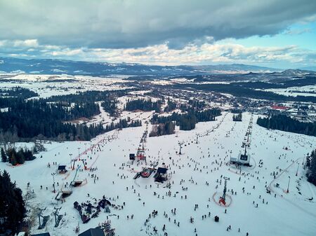 Beautiful panoramic aerial drone view to the ski slopes with lifts in the Bialka Tatrzanska ski resort Tatra Mountains (Tatras, Tatra) - mountain range between Slovakia and Poland, PLの写真素材