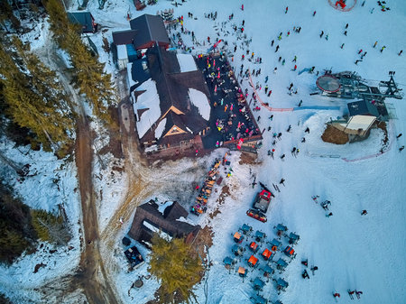 Beautiful panoramic aerial drone view to the ski slopes with lifts in the Bialka Tatrzanska ski...