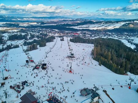 Beautiful panoramic aerial drone view to the ski slopes with lifts in the Bialka Tatrzanska ski resort Tatra Mountains (Tatras, Tatra) - mountain range between Slovakia and Poland, PLのeditorial素材