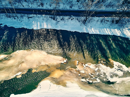 Panoramic aerial view: beautiful spring landscape: the Ulba river in Kazakhstan wakes up from winter...