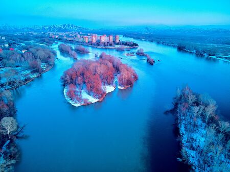 Panoramic aerial view: beautiful spring landscape: the Irtysh river in Kazakhstan wakes up from winter sleep - ice drift - snow and ice are melting at sunset, Qazaqstanの写真素材