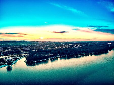 Panoramic aerial view: beautiful spring landscape: the Irtysh river in Kazakhstan wakes up from winter sleep - ice drift - snow and ice are melting at sunset, Qazaqstanの写真素材