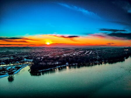 Panoramic aerial view: beautiful spring landscape: the Irtysh river in Kazakhstan wakes up from winter sleep - ice drift - snow and ice are melting at sunset, Qazaqstanの写真素材