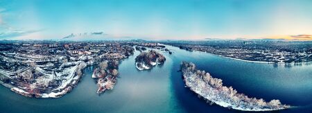 Panoramic aerial view: beautiful spring landscape: the Irtysh river in Kazakhstan wakes up from winter sleep - ice drift - snow and ice are melting at sunset, Qazaqstanの写真素材