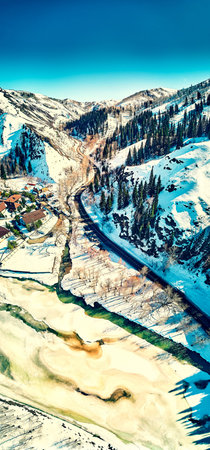 Panoramic aerial view: beautiful spring landscape: the Ulba river in Kazakhstan wakes up from winter...