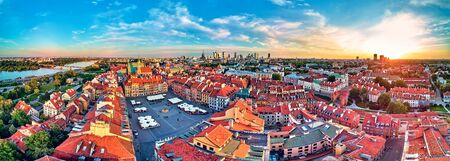 Beautiful panoramic aerial drone view on Warsaw Old town (POL: Stare Miasto) with modern skyscrapers on the horizon, square and the Column of Sigismund III Vasa at sunset, Poland.の写真素材