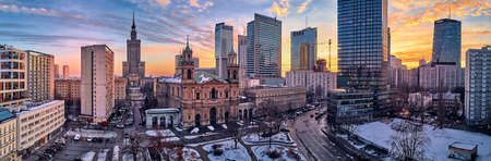 Beautiful panoramic aerial drone view on All Saints Church - Roman Catholic church located at Grzybowski Square, Warsaw City Skyscrapers, PKiN, and Varso Tower under construction. Warsaw, Poland.のeditorial素材