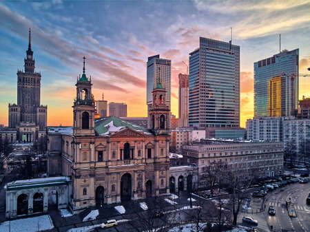 Beautiful panoramic aerial drone view on All Saints Church - Roman Catholic church located at Grzybowski Square, Warsaw City Skyscrapers, PKiN, and Varso Tower under construction. Warsaw, Poland.のeditorial素材