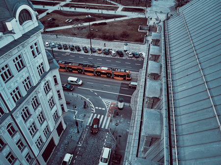 Beautiful panoramic aerial top-down drone view on snow-covered roofs of Warsaw 19th-century tenement...
