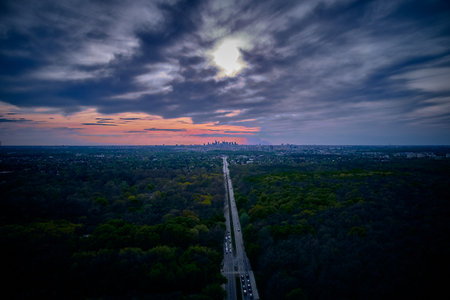 Beautiful panoramic aerial drone skyline sunset view of the road to the Polish Capital - Warsaw City Center with skyscrapers of the Warsaw City on the horizon, Poland, EU.の写真素材