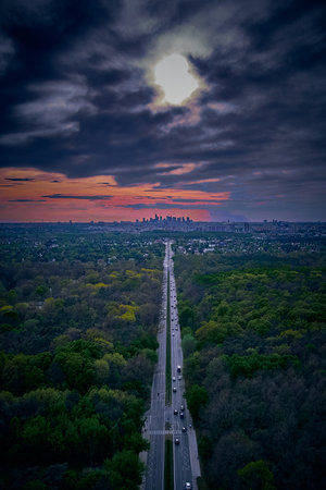 Beautiful panoramic aerial drone skyline sunset view of the road to the Capital - City Center with skyscrapers of the City on the horizon, Poland, EU.の写真素材