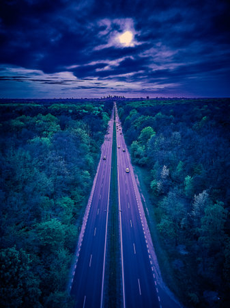Beautiful panoramic aerial drone skyline sunset view of the road with skyscrapers on the horizon.の写真素材