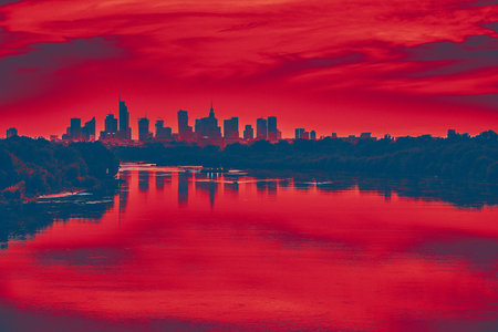 Beautiful panoramic aerial drone view of skyscrapers panorama at sunset, with reflection in Vistula river, Warsaw, Poland.の写真素材