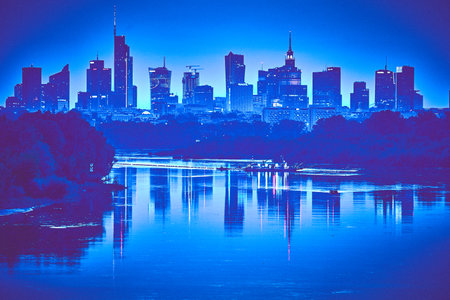 Beautiful panoramic aerial drone view of skyscrapers panorama at sunset, with reflection in Vistula river, Warsaw, Poland, EU.の写真素材